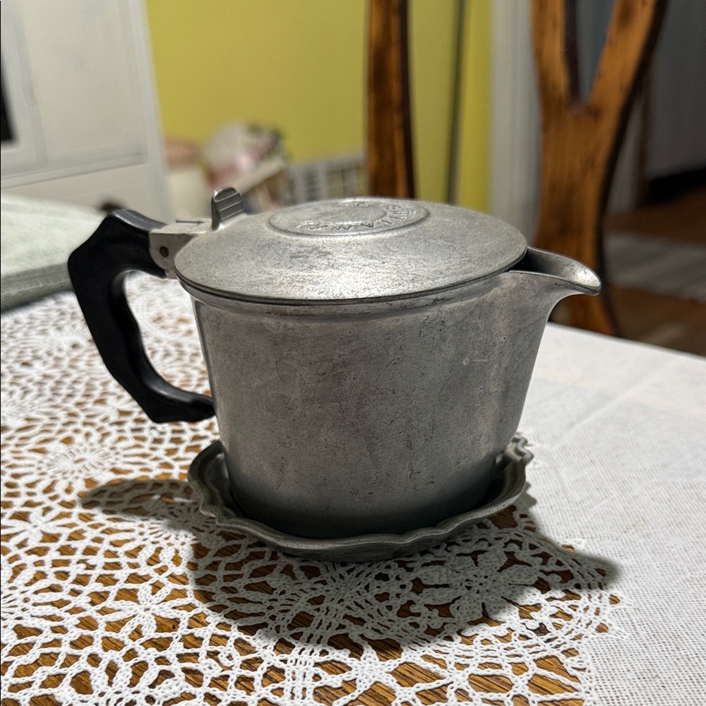 Elegant Silver Coffee Pot with Black Handle